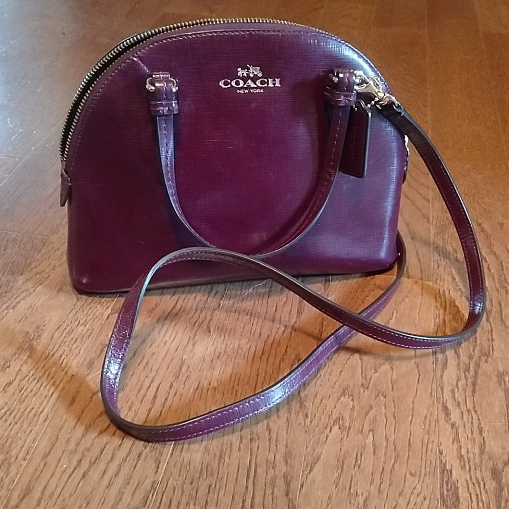 Coach curved top crossbody wine colored minibag